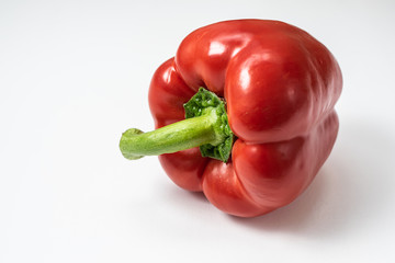 Fresh ripe red bell pepper isolated on white background.