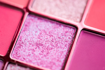 Glitter make-up product closeup. Eye shadow kit.
