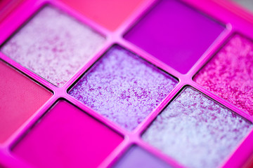 Pink glitter make up product closeup. Beauty products.