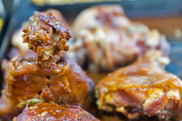 Barbecued chicken tasty drumsticks closeup