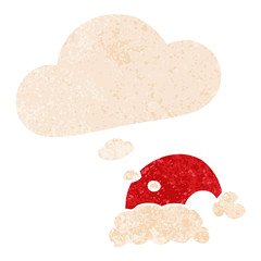 cartoon christmas hat and thought bubble in retro textured style