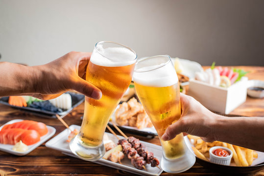 toasting image with beer and japanese izakaya food