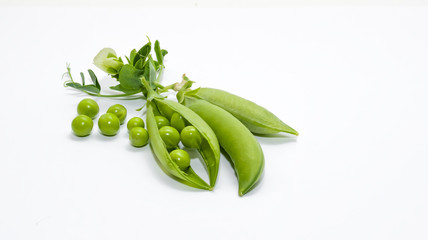 Green peas on a white background. Fresh harvest. Design.