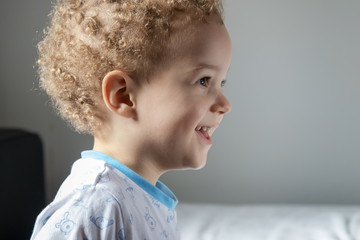 Portrait of little boy in pyjamas before going to sleep
