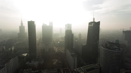 Aerial view. Flying in a foggy morning in the direction of the skyscrapers in the center of Warsaw.