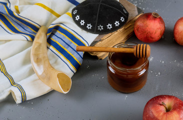 Apples, pomegranate and honey for Rosh Hashanah torah book, kippah a yamolka talit