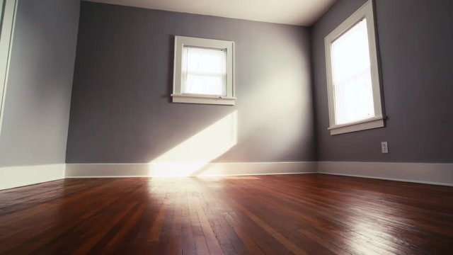 Empty Bedroom with Hardwood Floor Move Left. view moves left on a gray bedroom with hardwood floor