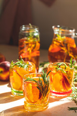 Glasses with drops of sweet peach iced tea