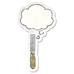 cartoon metal file and thought bubble as a distressed worn sticker