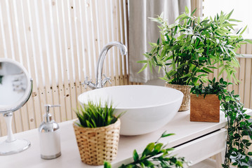 Spacious modern Scandinavian loft bathroom. Sink. Lots of plants. Bright room. Modern interior. 