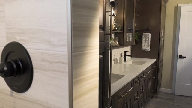 Master Bathroom Reveal from Shower Move Right. view moves right on a master bathroom scene revealing the double sink and vanity from the shower