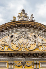 Decorative facade gable of a beautiful old abandoned building, Strada George Baritiu or George Baritiu Street in Cluj-Napoca, Transylvania, Romania