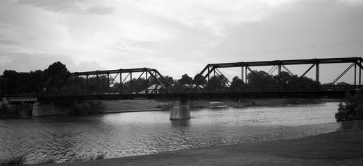 bridge over river at sunset