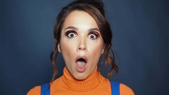 Attractive girl expressing bewilderment. Surprise on female face