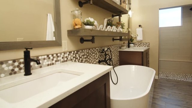 Master Bathroom Rise on Tub and Shelf. view moves up on master bathroom with double vanity sinks and tub in between