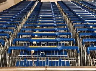 nested shopping cart of a discounter, three rows next to each other,