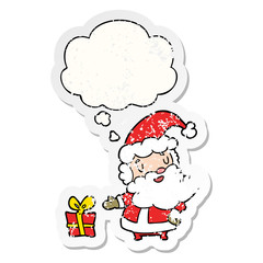 cartoon santa claus and thought bubble as a distressed worn sticker