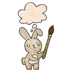 cartoon rabbit with paint brush and thought bubble in grunge texture pattern style