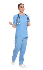 Full length portrait of medical doctor with clipboard and stethoscope isolated on white