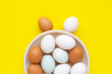 Eggs on yellow background.  Happy easter bunny.