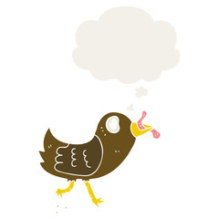 cartoon bird with worm and thought bubble in retro style