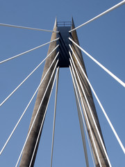 a view of the tower and cables on the marine way suspension bridge in southport merseyside against a blue summer sky