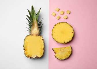 Flat lay composition with cut and fresh juicy pineapples on color background