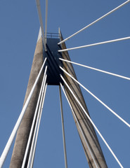 Obraz premium a view of the tower and cables on the marine way suspension bridge in southport merseyside against a blue summer sky