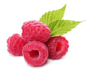 Delicious fresh ripe raspberries with leaves on white background