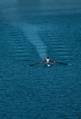 Two Male Rowers In A Double Racing Boat With Synchronous Oar Stroke