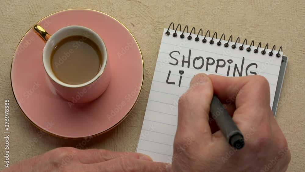 Canvas Prints shopping list - a man hand writing a note with a black marker in a spiral notebook, overhead view