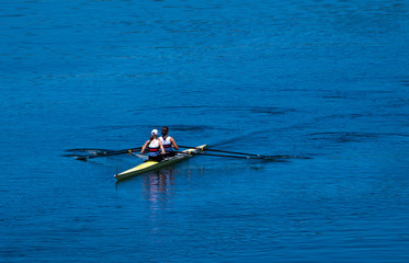 Two Female Rowers In A Double Racing Boat With Synchronous Oar Stroke © grafxart