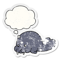 cute cartoon walrus and thought bubble as a distressed worn sticker
