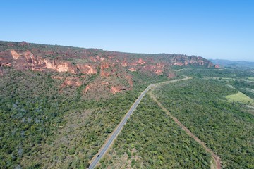 Aerial view of MT 241 road, way to Chapada dos Guimarães, Mato Grosso, Brazil. Great landscape. Travel destination. Vacation travel. Touristic point.