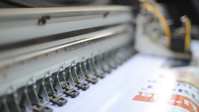 Large format inkjet printing press in operation.