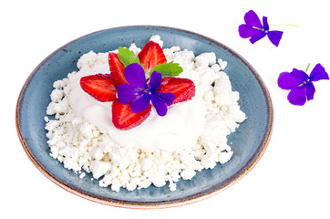 Fresh granulated cottage cheese with strawberries. Photo