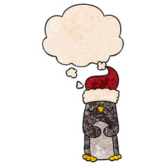 cartoon christmas penguin and thought bubble in grunge texture pattern style