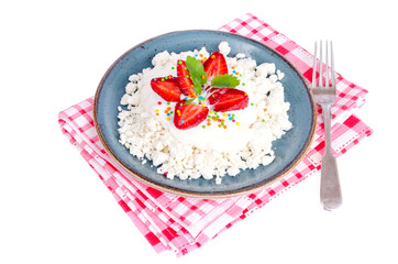 Fresh granulated cottage cheese with strawberries. Photo