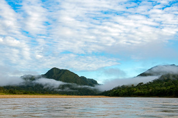 Green rainforest mountains in clouds, Amazon river basin, South America
