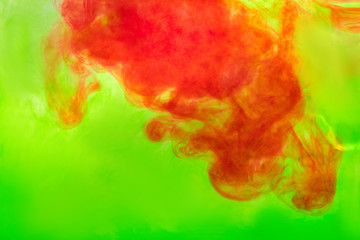 red ink diluted in green water