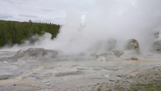 Geothermal hot springs boil and release steam into the Yellowstone basin