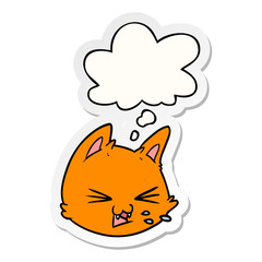 spitting cartoon cat face and thought bubble as a printed sticker