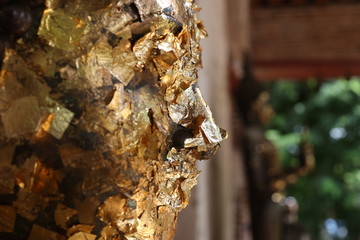 Close-Up of the Gold Leaf on Buddha Statue