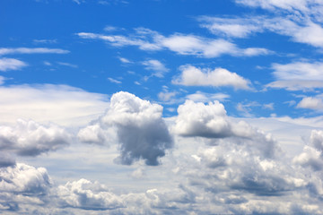 The vast blue sky background and white clouds