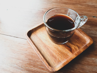 cup of coffee on wooden table