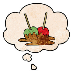 cartoon toffee apples and thought bubble in grunge texture pattern style