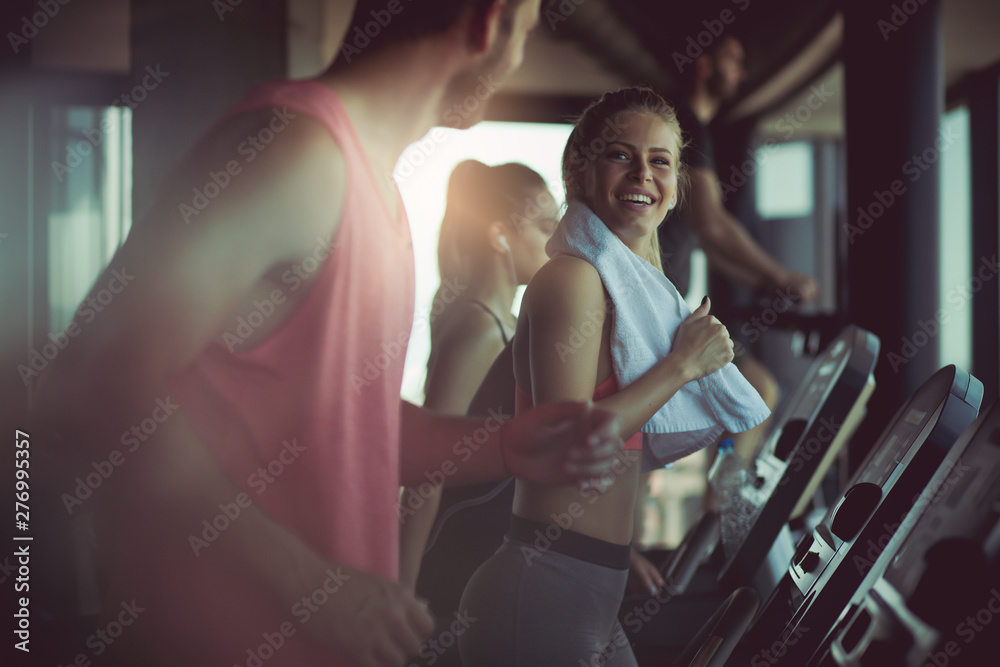 Wall mural Having a gym buddy makes exercising more fun.