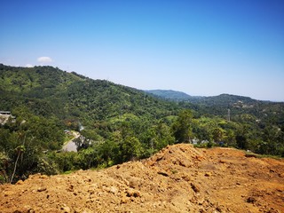 Hill cutting on Penampang highland for housing plots in Kota Kinabalu, Sabah. Malaysia, Borneo.