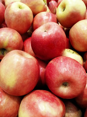 , a shop window ripe red varieties of apples, a healthy lifestyle in the summer, many apples