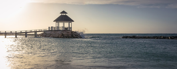 Oceanside Gazeebo Sunset Beach with Lifeguard Chair and Wind Flag